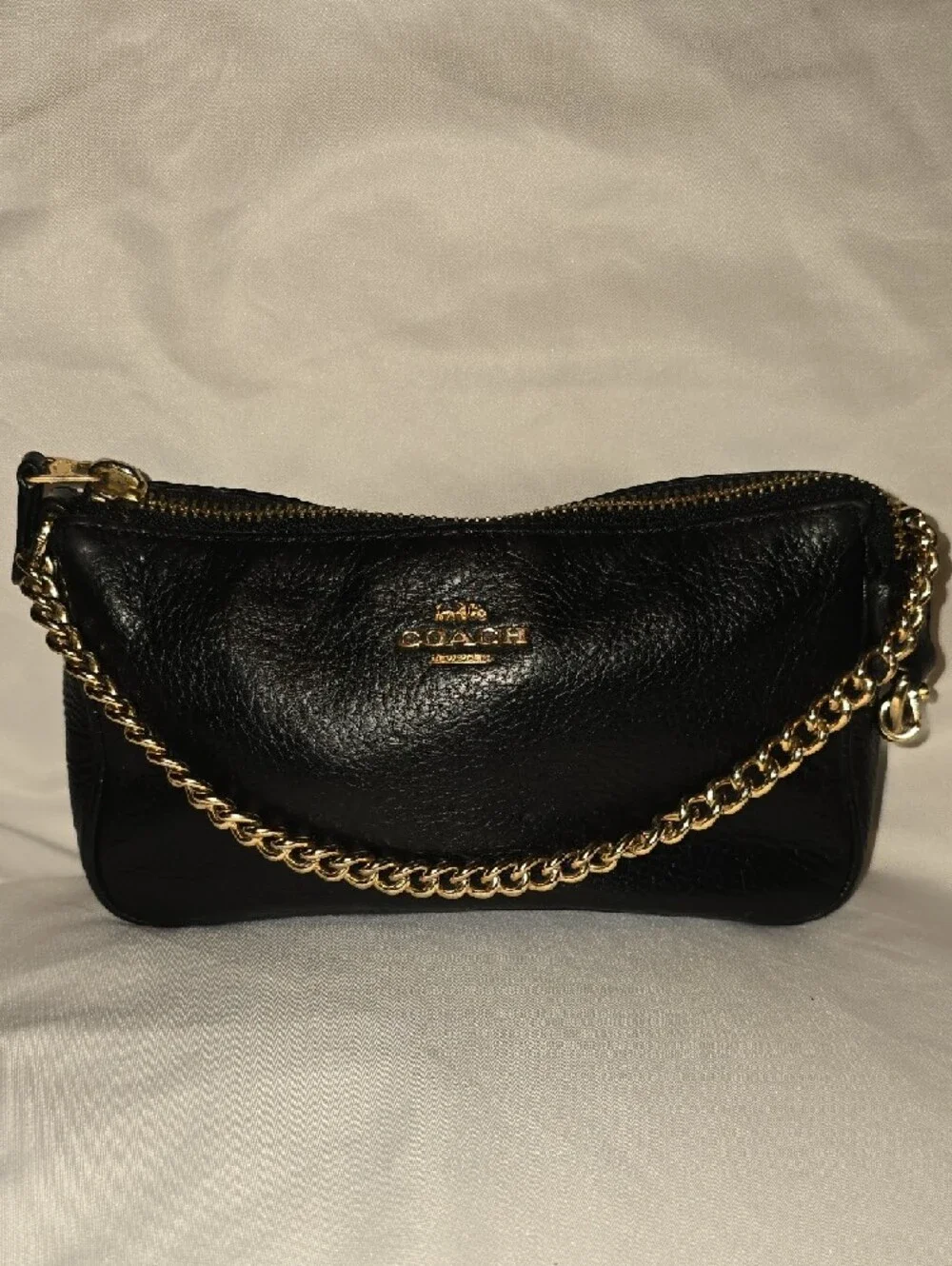 Coach Black Leather Mini Wristlet with Gold Chain 8' L x 5' H.
